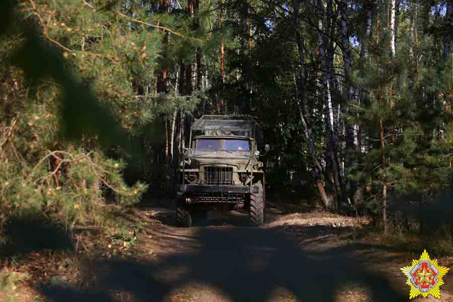 Belarusian military install armored vehicles with anti-drone grills and troops near the border with Ukraine