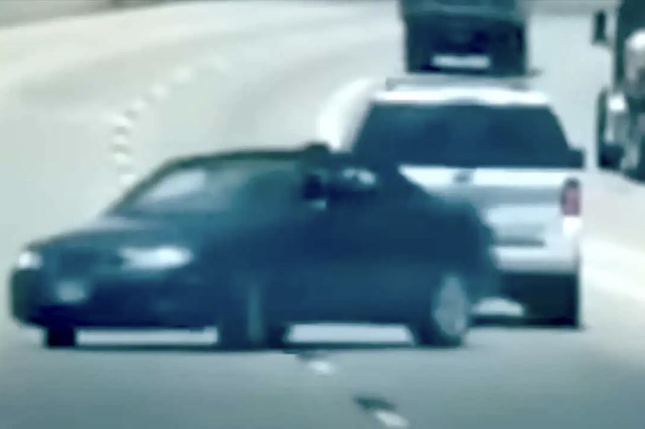 Man arrested after attempting to tow a car in reverse on a US highway