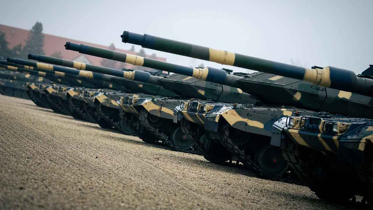 Tanks lined up in military formation.
