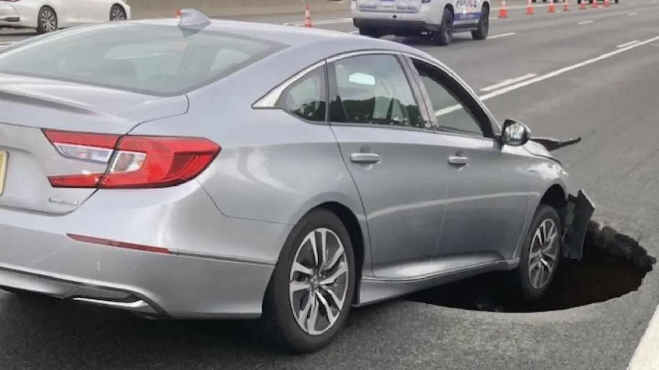 Sinkhole 10 feet wide swallows car and closes lanes on New York highway